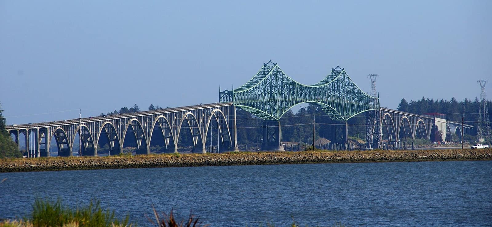 The Conde B. McCullough Memorial Bridge crossing Coos Bay, with its green steel arches and long concrete approach spans