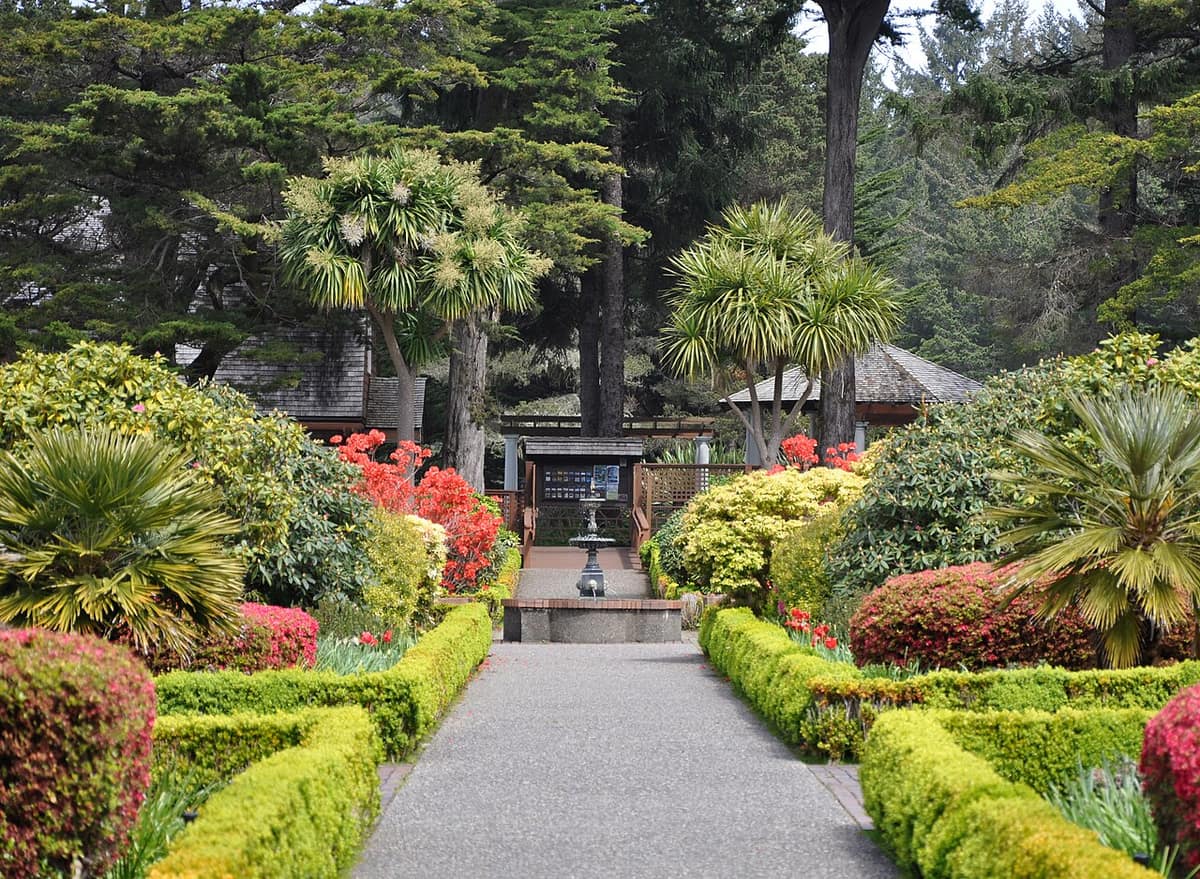 formal garden at Shore Acres State Park with hedges, rhododendrons, and a fountain